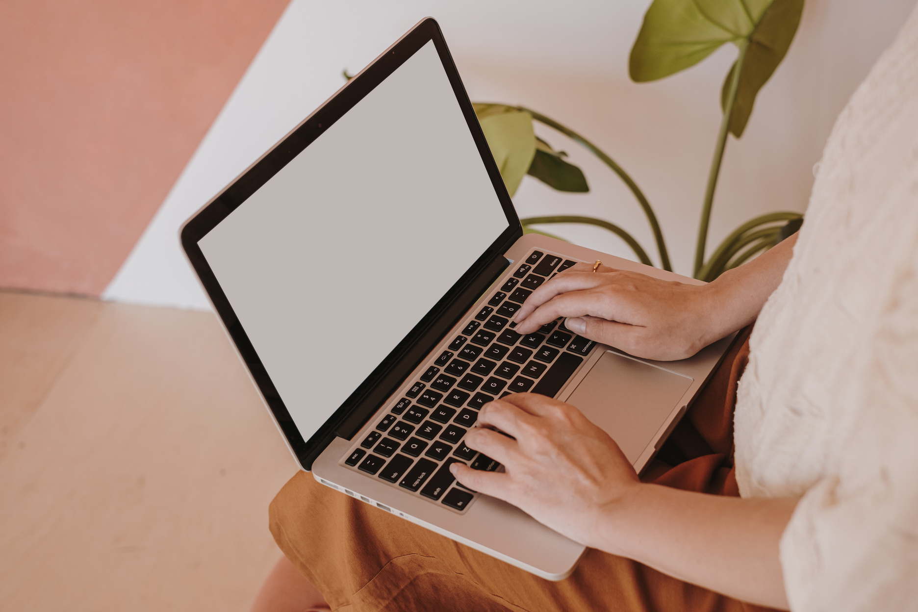 Woman Working with Laptop at Home